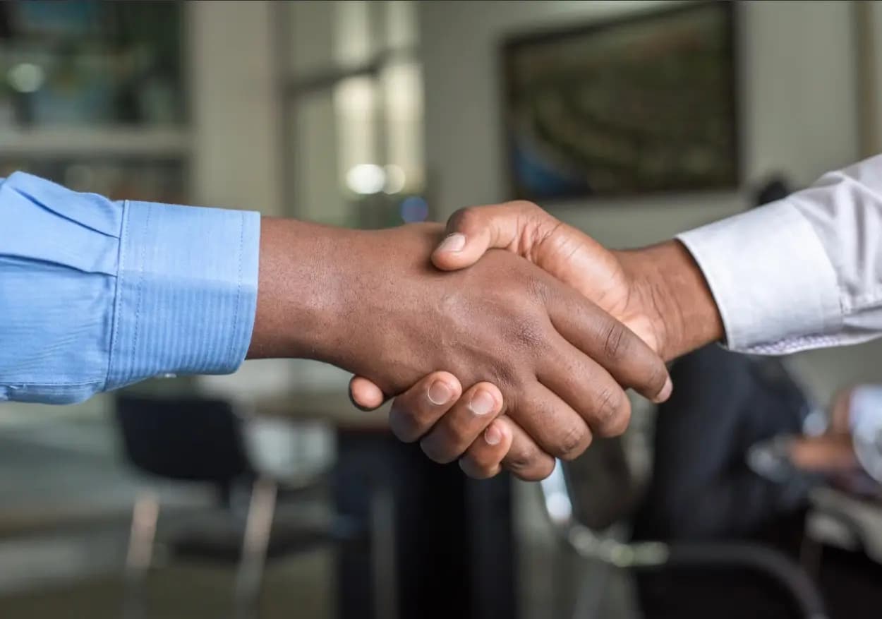 Advisor and client shaking hands